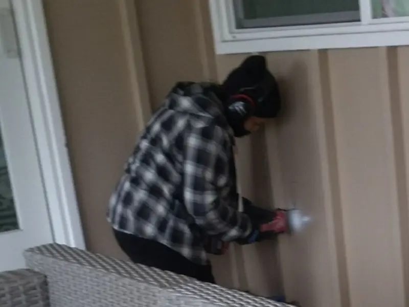 Professional electrician installing an exterior outlet in Belleville