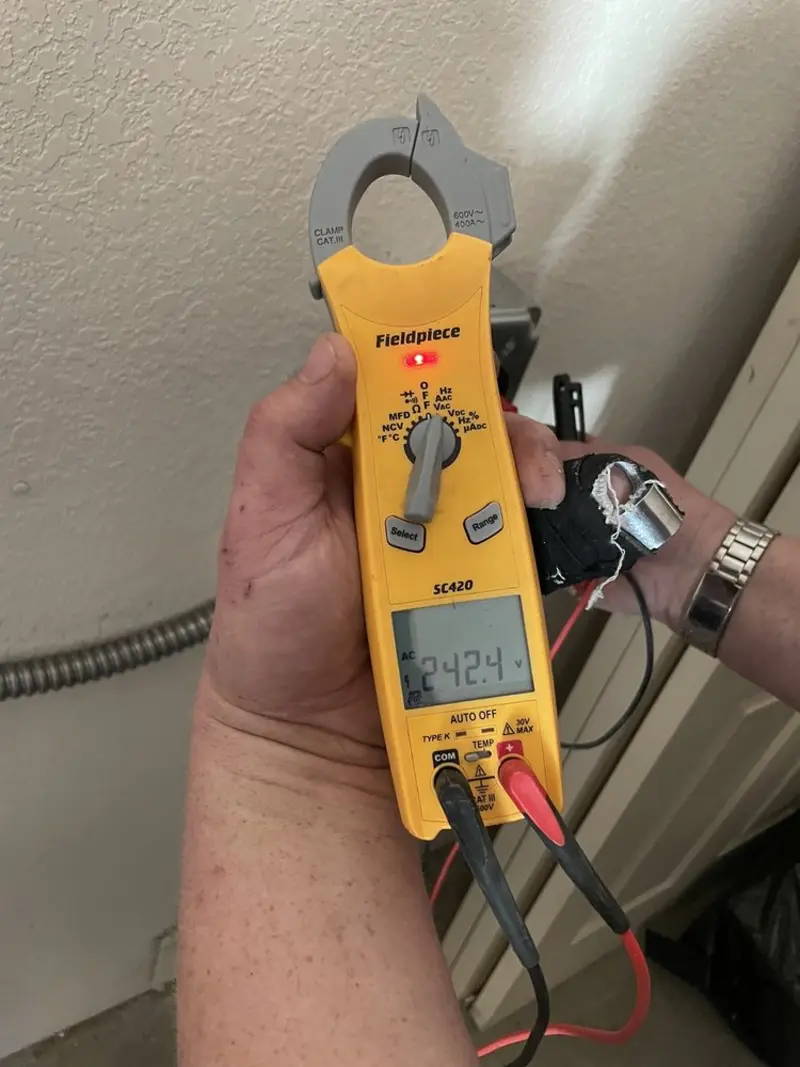 Voltage testing with clamp meter during Whole House Surge Protector in Belleville